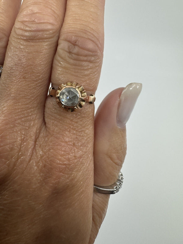 Front view of the antique 14ct rose gold solitaire ring worn on the hand, showing the rose-cut diamond face-up.