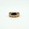 Straight-on view of antique 12ct rose gold wide band ring Size J, showing domed band and engraving