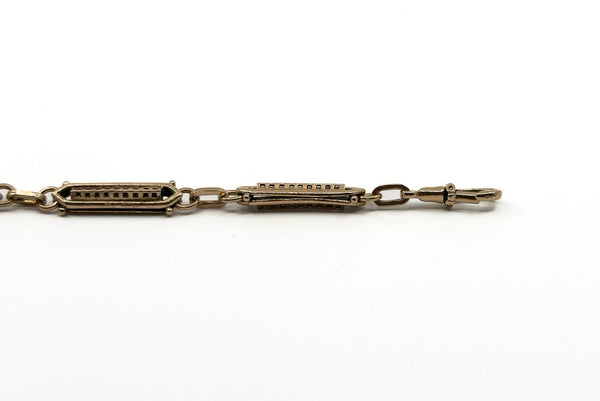 Antique rose gold bracelet showing fancy links and one dog clip fitting