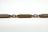 Close up of the antique rose gold bracelet with raised fancy link detailing