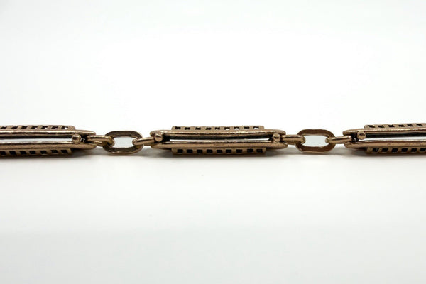 Close up of the antique rose gold bracelet with raised fancy link detailing