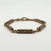 Antique rose gold bracelet showing shaped fancy links and double dog clip closure