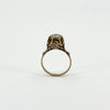 Full side profile of the antique rose gold ring showing the raised rose-cut diamond and decorative openwork setting.