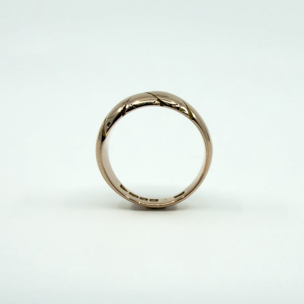 Side profile of antique 12ct rose gold wide band ring, Size J, showing chunky domed band