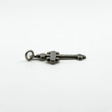 Side view of antique sterling silver engraved cross pendant showing its raised shape and bail