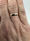 Antique Victorian 9ct rose gold band ring shown worn on the finger for scale