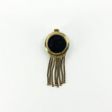 Reverse of Victorian 18ct gold tassel locket showing the removable glass-backed keepsake compartment.