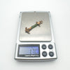 Pendant weighed on digital scale showing 1.7g