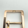Detailed view of maker’s mark C.M on antique 9ct gold buckle charm