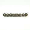 Front view of antique sterling silver bar brooch with clear paste stones and pearl clusters.