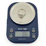 Antique platinum old-cut diamond solitaire ring shown on digital scales weighing 3.86g