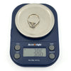 Antique platinum old-cut diamond solitaire ring shown on digital scales weighing 3.86g