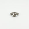 Front view of antique platinum old-cut diamond solitaire ring with engraved shoulders