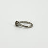 Side profile of antique old-cut diamond solitaire ring with PLAT mark visible inside the band