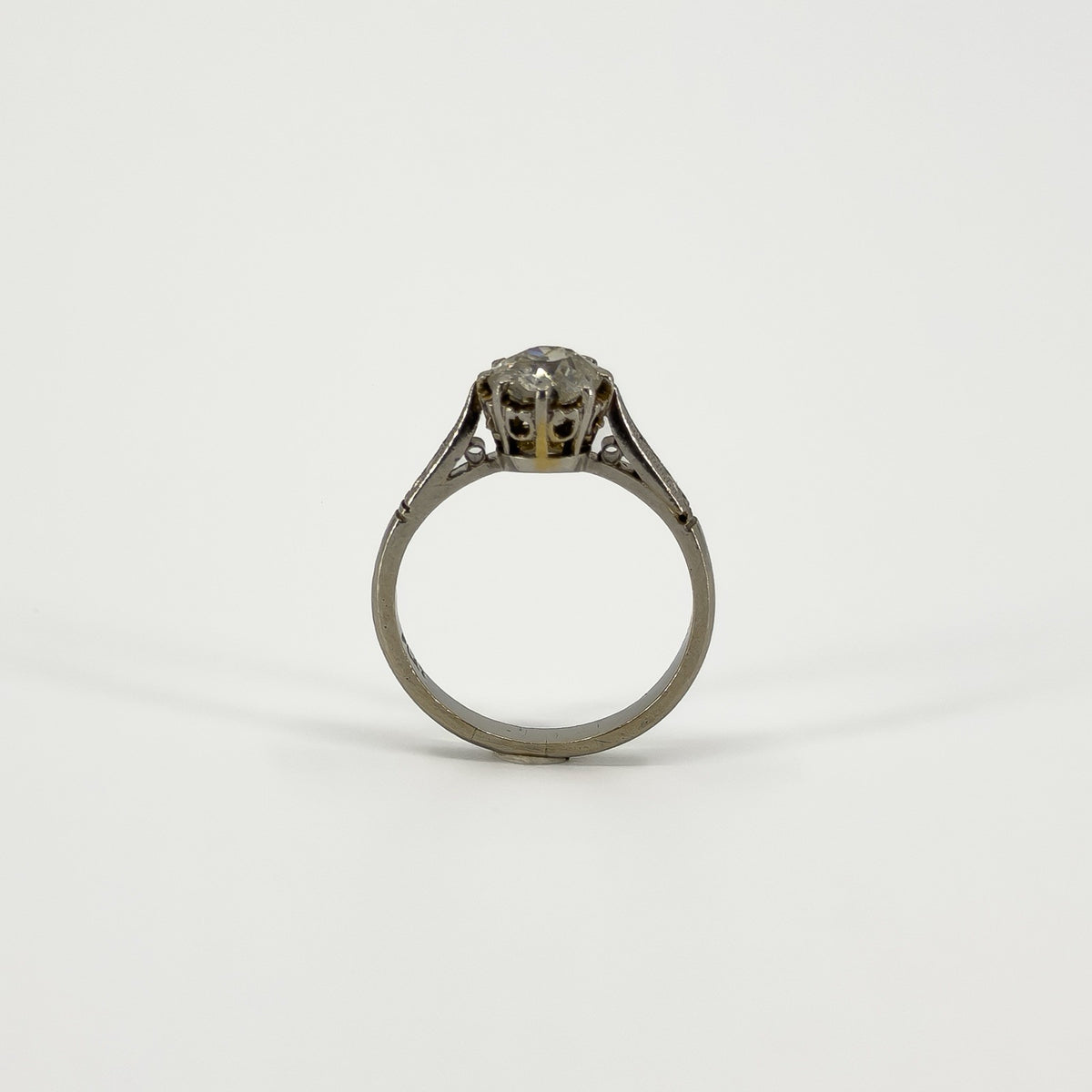 Rear view of antique platinum old-cut diamond solitaire ring showing open gallery setting