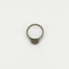 Top view of antique platinum diamond solitaire ring showing open gallery and engraved shoulders