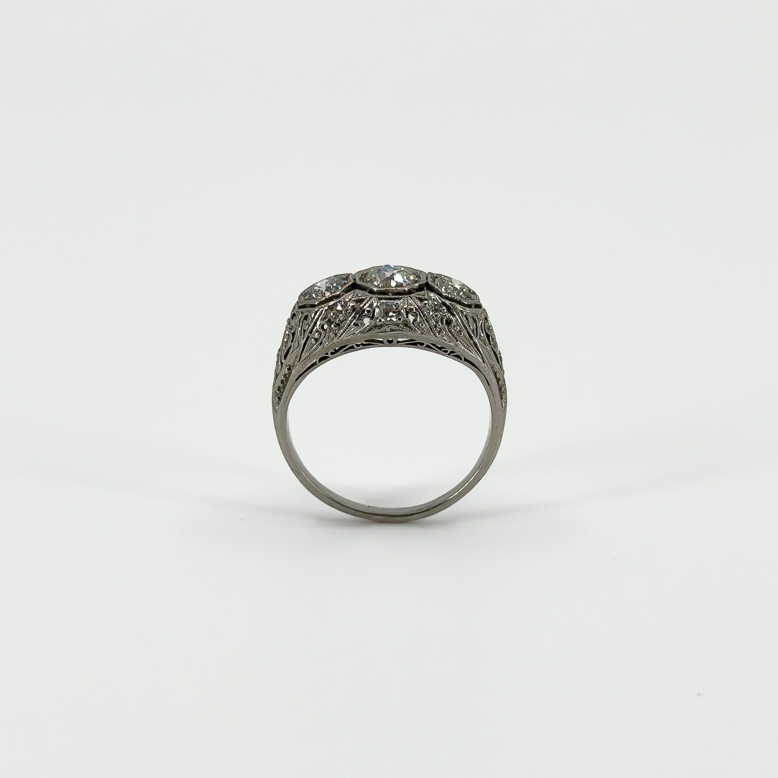 Side view of Art Deco platinum diamond ring showing pierced filigree gallery