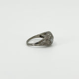 Side view of platinum diamond trilogy ring with engraved filigree openwork
