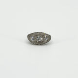 Front view of Art Deco platinum 1ct diamond trilogy ring on a white background