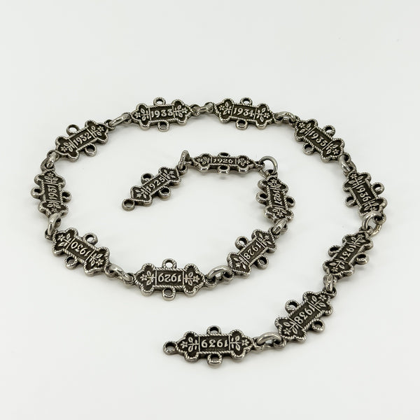 Front view of the Art Deco sterling silver watch chain showing linked annual examination bars from 1925 to 1939.