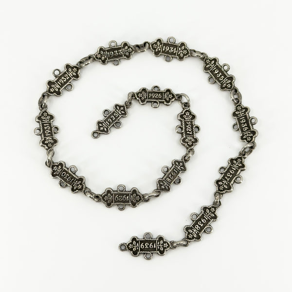 Art Deco sterling silver St Johns Ambulance watch chain with 15 linked examination bars dated 1925 to 1939.