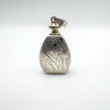 Vintage 925 silver engraved perfume pendant showing detailed scrollwork on back