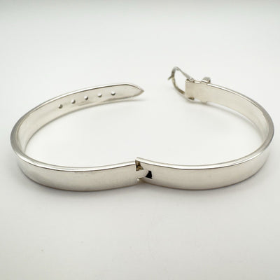 Rear angle of sterling silver bangle bracelet with buckle detail