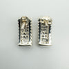 Reverse view of chunky half hoop earrings with 925 stamp visible