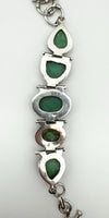 Reverse view showing turquoise settings and silver backplate