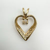 Reverse side of 9ct gold heart pendant showing open back setting and CZ stone mounting.
