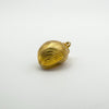 Back of vintage 9ct gold sea shell pendant showing textured detail