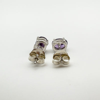 Rear view of 925 stamped amethyst stud earrings with backs attached