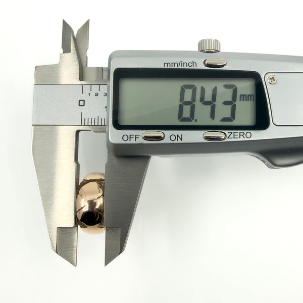 Digital callipers measuring band width at 8.43mm on the antique 12ct gold ring