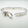 Hinged silver buckle bangle opened to show adjustable holes