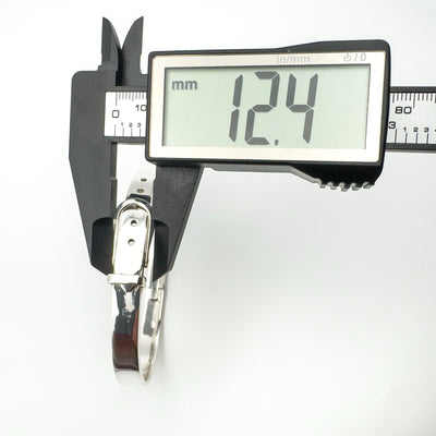 Digital caliper measuring sterling silver bangle width at 12.4mm