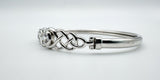 Angled shot showing the depth of CZ stone and openwork silver knot