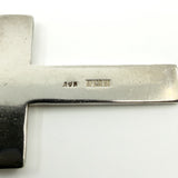 Close up of the AJH Birmingham 1973 sterling silver hallmarks on the cross pendant.