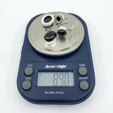 Pair of sterling silver black onyx drop earrings on digital scales weighing approximately 8.9g