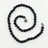 Top view of black freshwater baroque pearl necklace with 49 hand knotted chunky pearls
