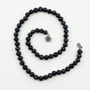Top view of black freshwater baroque pearl necklace with 49 hand knotted chunky pearls
