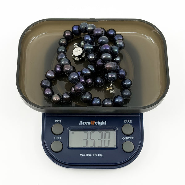 New black freshwater baroque pearl necklace on digital scales weighing approximately 35.3g