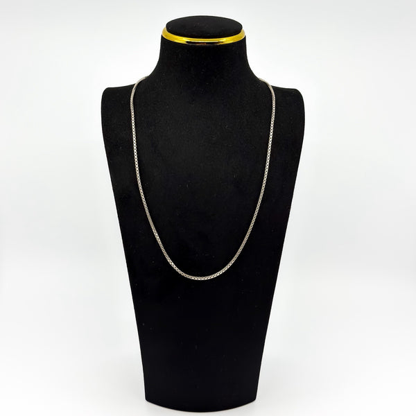 Vintage sterling silver box chain necklace displayed on a black jewellery bust, showing its 22 inch length.
