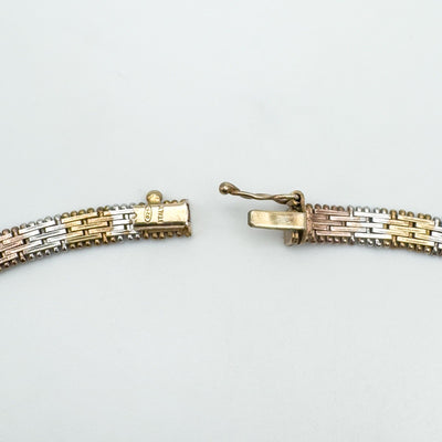 Push clasp of bracelet showing 925 ITALY stamp in tricolour silver