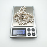Pearl bracelet weighing 22.03g shown on digital scale