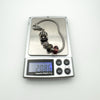Trollbeads charm bracelet shown weighing 20.86 grams on scale