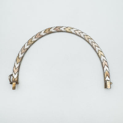 Rose, yellow and white plated sterling silver bracelet shown from above