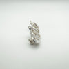 Angled detail showing side profile of sterling silver and shell Celtic brooch