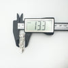 Measuring height of vintage mother of pearl Celtic brooch at 13.3mm