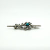 Profile view of vintage sterling silver turquoise brooch showing the C hook clasp and pin.