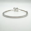 Rear profile of sterling silver bangle with round cut CZ